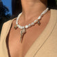 Pearl_necklace_with_shell_pendant